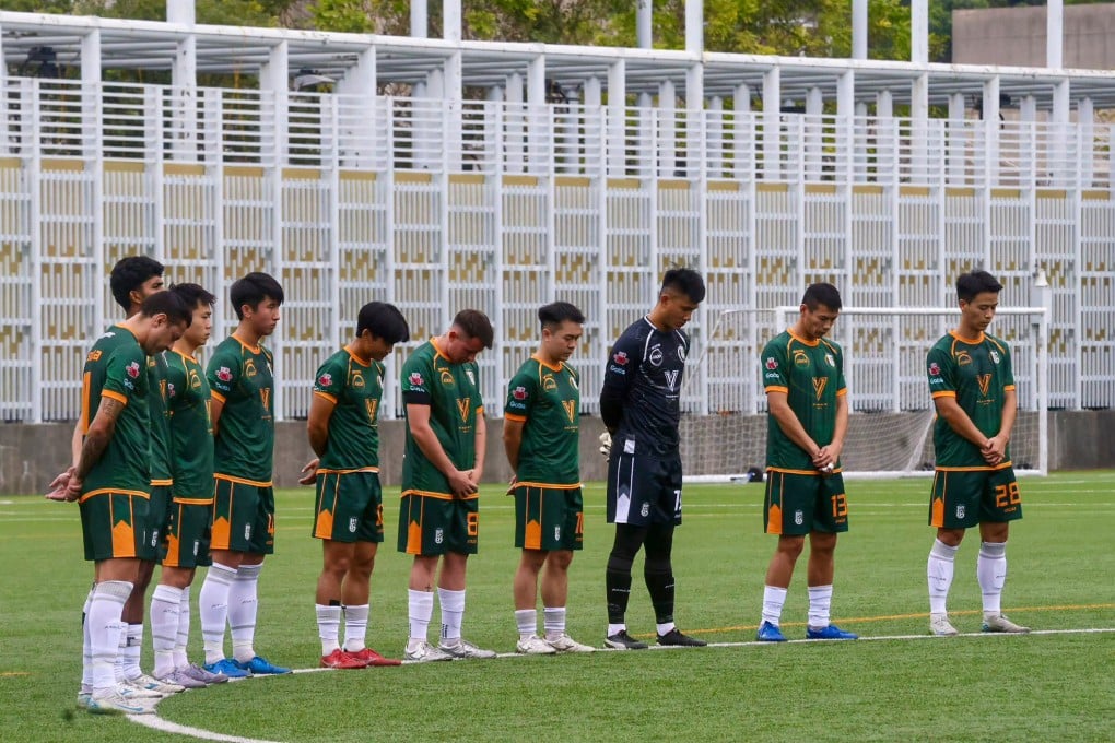 Sham Shui Po’s players observe a minute’s silence before their Division 1 match against South China at Po Kong Village Road Sports Centre. Photo: Jonathan Wong