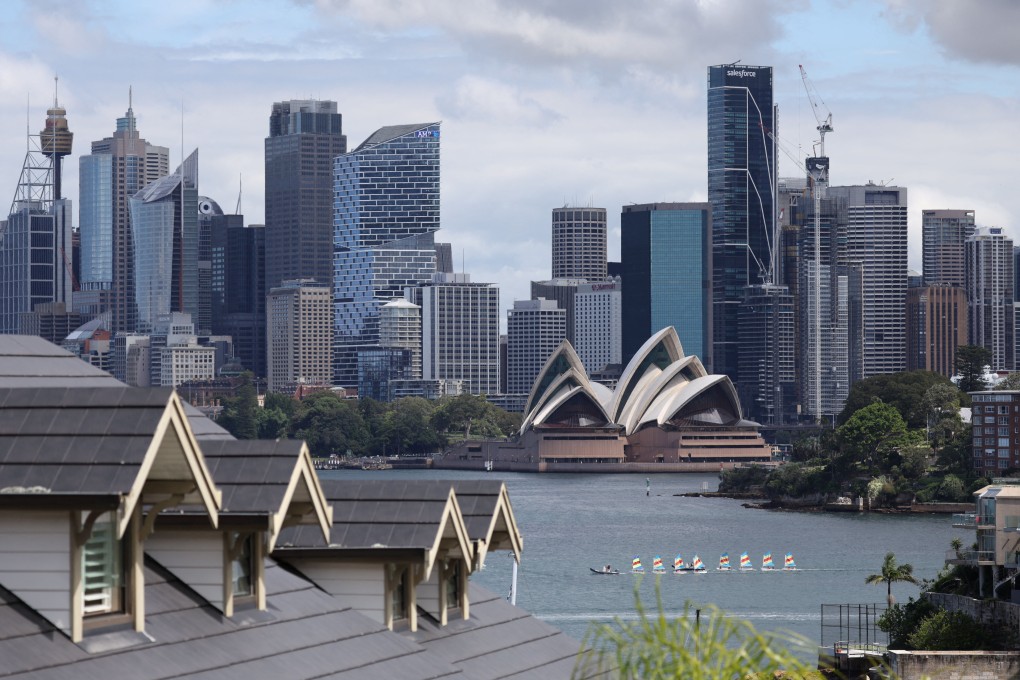 The Sydney skyline is seen from a suburb. Four men have been arrested in the city for possessing “satanic” child abuse material. Photo: Reuters