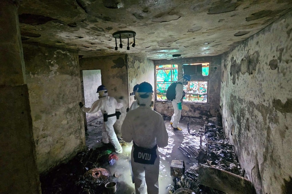 Members of the Disaster Victim Identification Unit search one of the burned buildings at Wang Fuk Court in Tai Po. Photo: handout