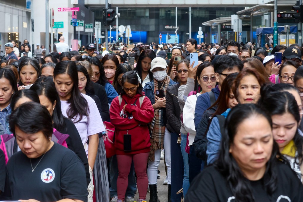 Helpers mourn those killed in the deadly Tai Po fire. Photo: Jonathan Wong