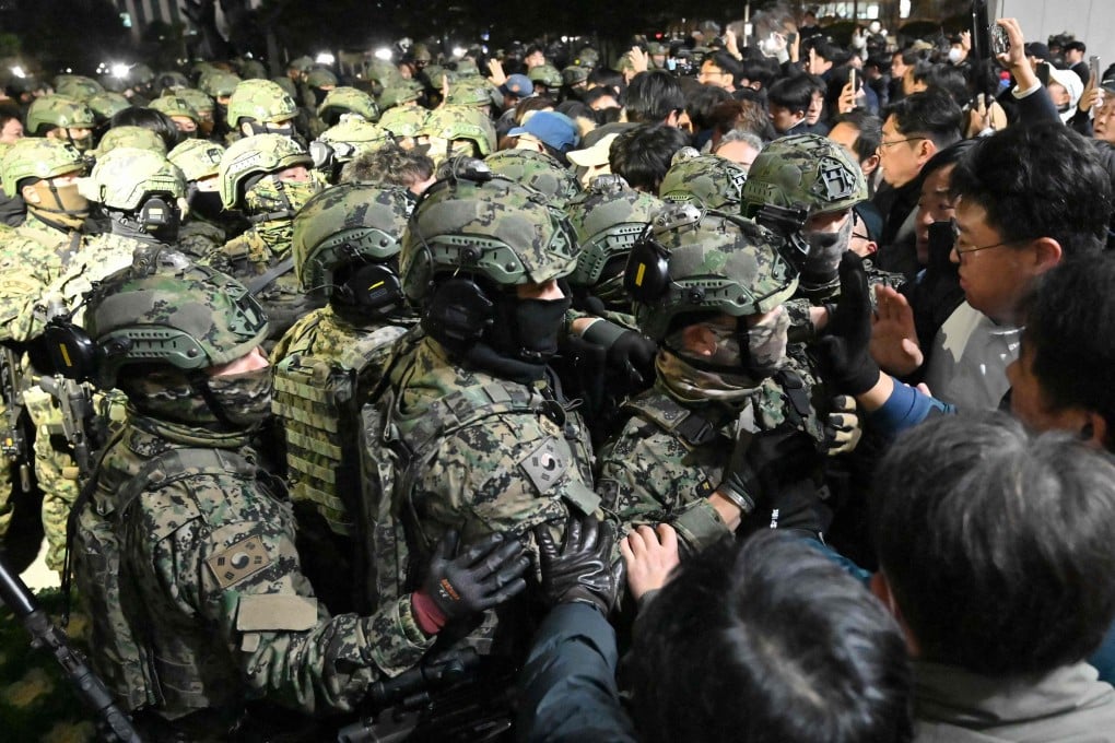South Korean soldiers try to enter the National Assembly building in Seoul, after then president Yoon Suk-yeol declared martial law on December 3, 2024. Photo: AFP