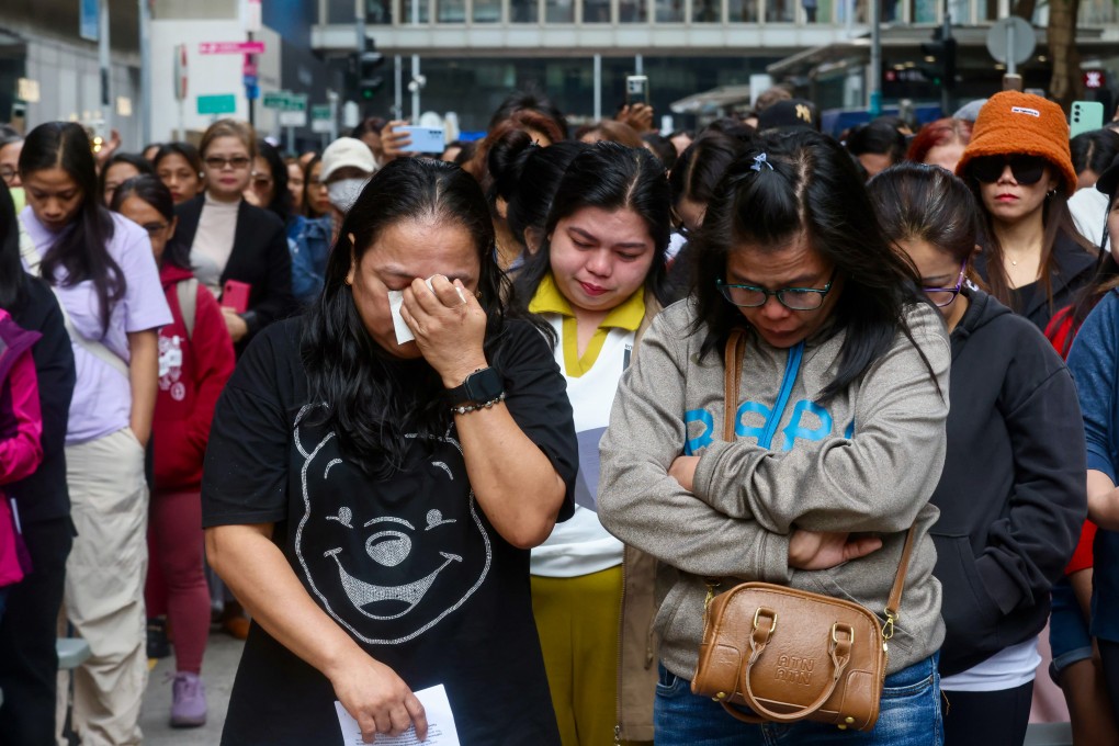 Domestic helpers mourn victims of the Tai Po fire at a prayer gathering in Central. Photo: Jonathan Wong