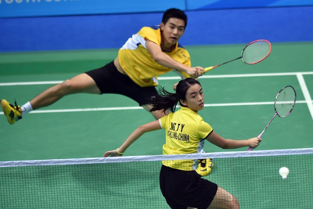 Hong Kong’s Yoyo Ng (front) and Cheam June Wei of Malaysia won the mixed doubles gold medal at the 2014 Youth Olympic Games in Nanjing. Photo: Xinhua