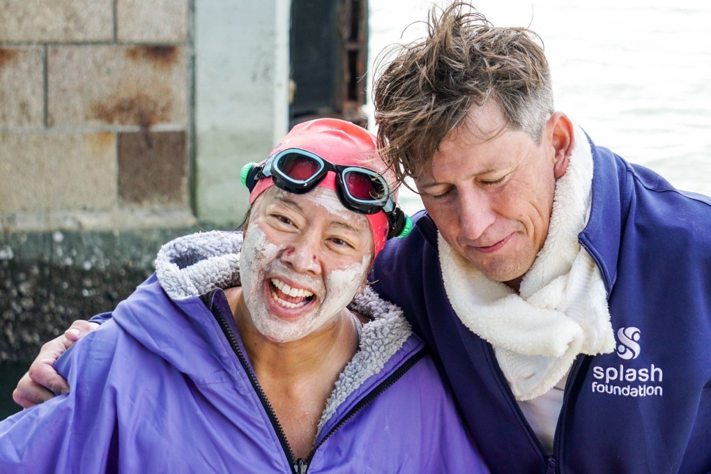 An elated Edie Hu shares an embrace with her open water swimming partner Simon Holliday after the two completed a 65km circumnavigation of Lantau Island on November 20, 2025 - a world’s first. Photo: Amy Miao