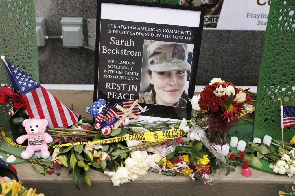 Tributes are seen on Tuesday at the scene where two National Guard members were shot in Washington. Photo: EPA