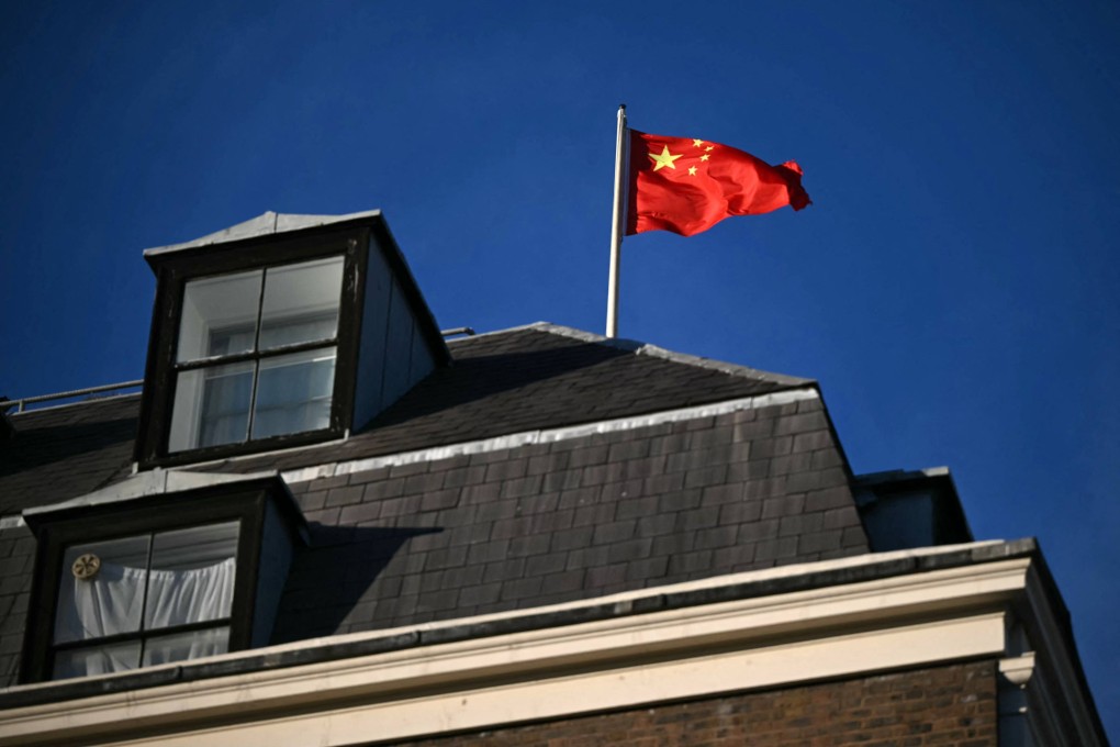 A Chinese national flag flies atop the Embassy of the People’s Republic of China in the United Kingdom, in London. Photo: AFP