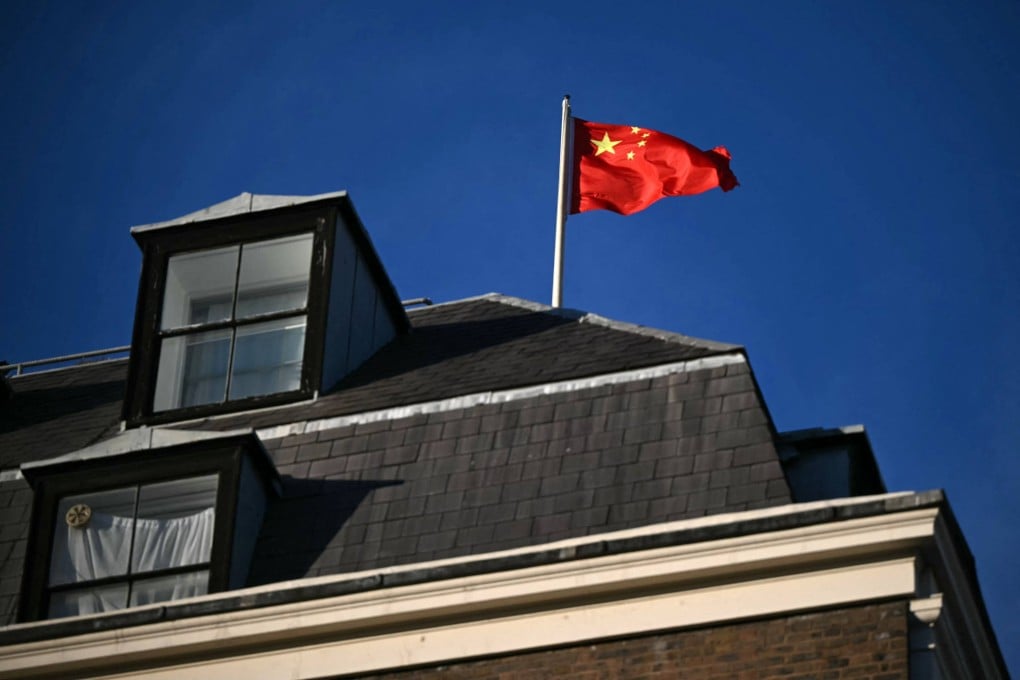 A Chinese national flag flies atop the Embassy of the People’s Republic of China in the United Kingdom, in London. Photo: AFP