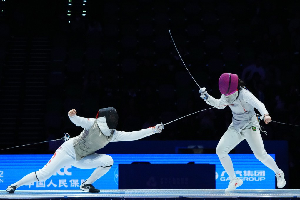 Huang Qianqian (left) and Wang Yiran in the women’s foil individual final at the National Games in Hong Kong last month. Photo: Xinhua