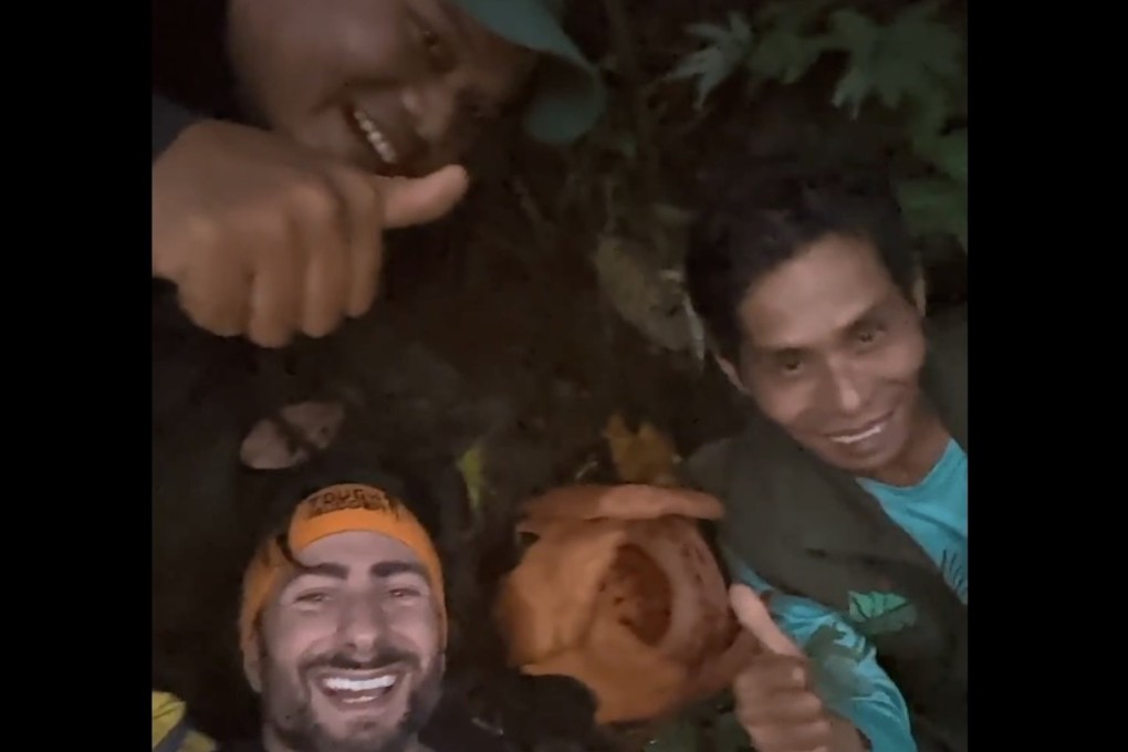 Oxford scientist Chris Thorogood and his Indonesian team members posing next to Rafflesia hasseltii, after they rediscovered the rare giant parasitic red flower in West Sumatra last month. Photo: X/University of Oxford