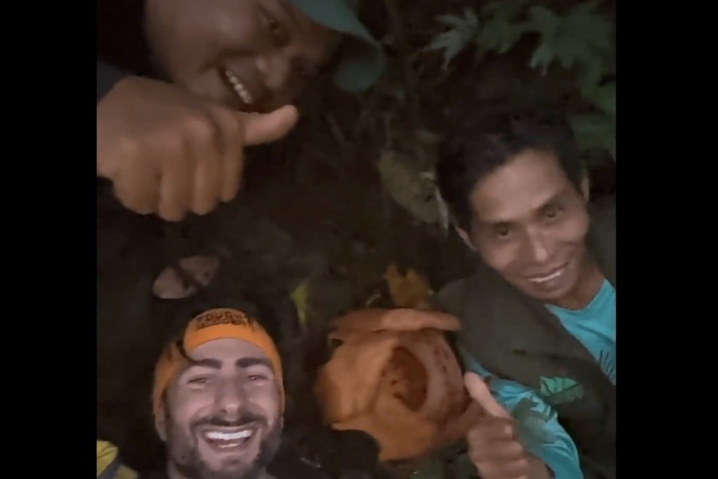 Oxford scientist Chris Thorogood and his Indonesian team members posing next to Rafflesia hasseltii, after they rediscovered the rare giant parasitic red flower in West Sumatra last month. Photo: X/University of Oxford