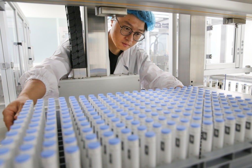 A worker checks the position of a feeding tray in a pharmaceutical manufacturing facility at the Hengrui Biomedical Industrial Park in Lianyungang in Jiangsu province, on December 13, 2021. Photo: Getty Images