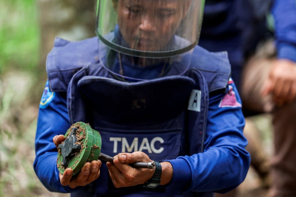 A member of the Thailand Mine Action Centre shows a landmine during a media visit to the border province of Surin, Thailand, in August. Photo: Reuters