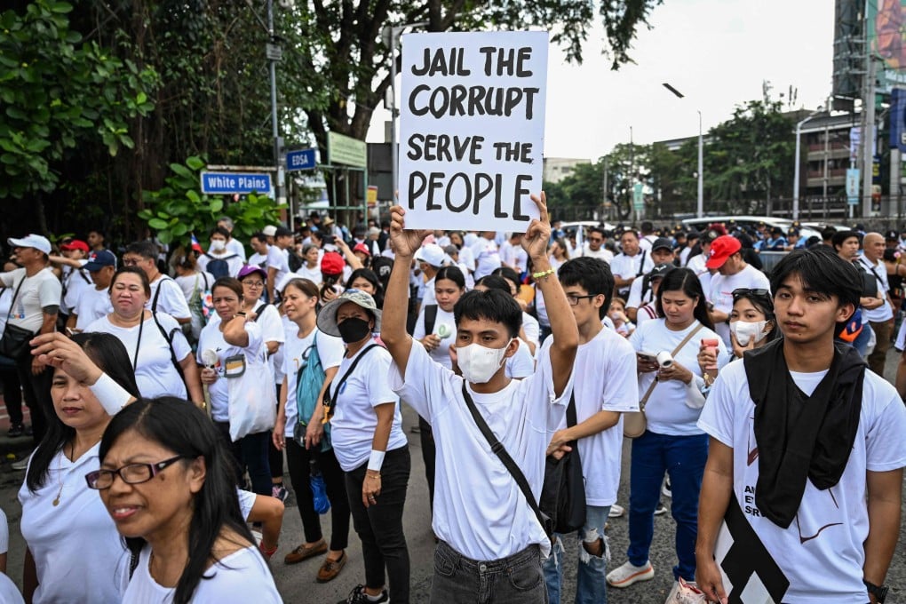 Protesters take part in an anti-corruption rally along Epifanio de los Santos Avenue, or EDSA, in Quezon City, Metro Manila on Sunday. Police estimated that about 90,000 people joined rallies nationwide that day. Photo: AFP