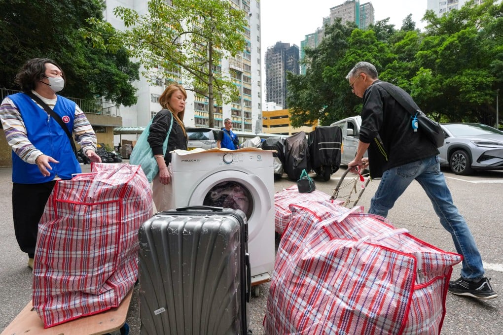Residents had 90 minutes to gather belongings from their flats at Wang Chi House at Wang Fuk Court. Some chose to carry just small essentials while others decided to move out larger items. Photo: Karma Lo