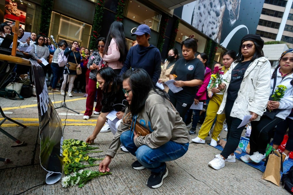 People mourn the domestic helpers who lost their lives in the Tai Po fire, at community prayers at Chater Road in Central on November 30. Photo: Jonathan Wong