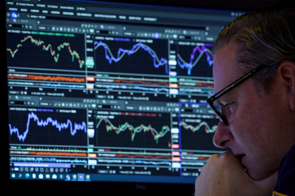 A trader at work on the floor of the New York Stock Exchange,  November 19, 2025. Photo: Reuters