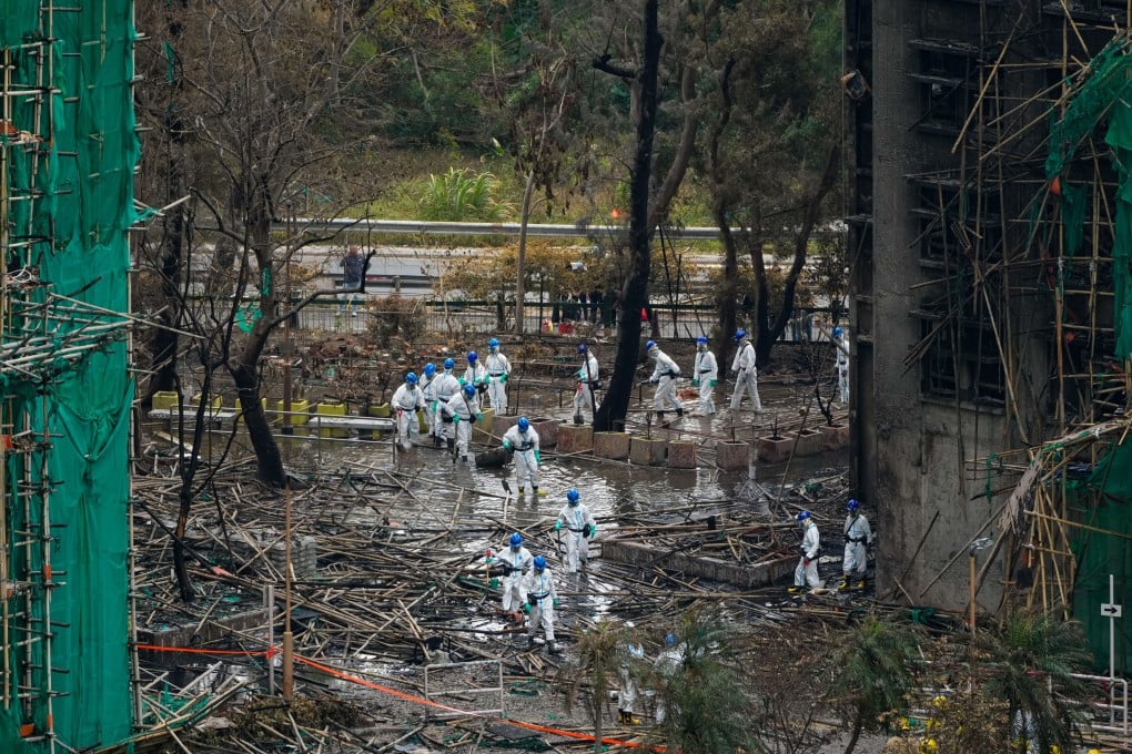 Members of the Disaster Victim Identification Unit carry out their work at Wang Fuk Court. Photo: Sam Tsang