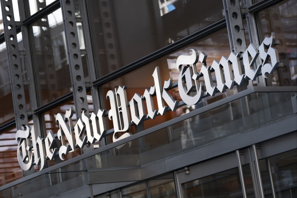 A sign for The New York Times hangs above the entrance to its building in New York. Photo: AP