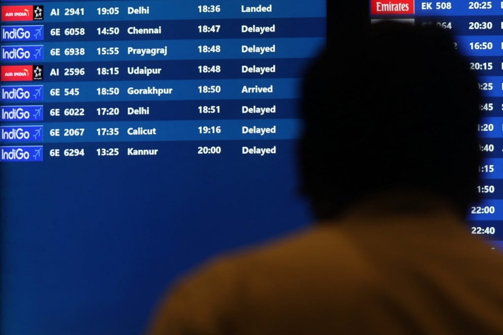 A man looks at a screen displaying delayed IndiGo Airlines flights at Mumbai’s Chhatrapati Shivaji Maharaj International Airport on Wednesday. Photo: Reuters
