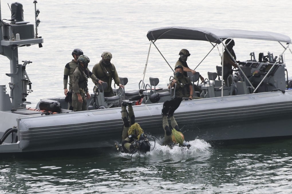 Special Duties Unit members dive into the sea to search for evidence in a recent case. Photo: Jelly Tse