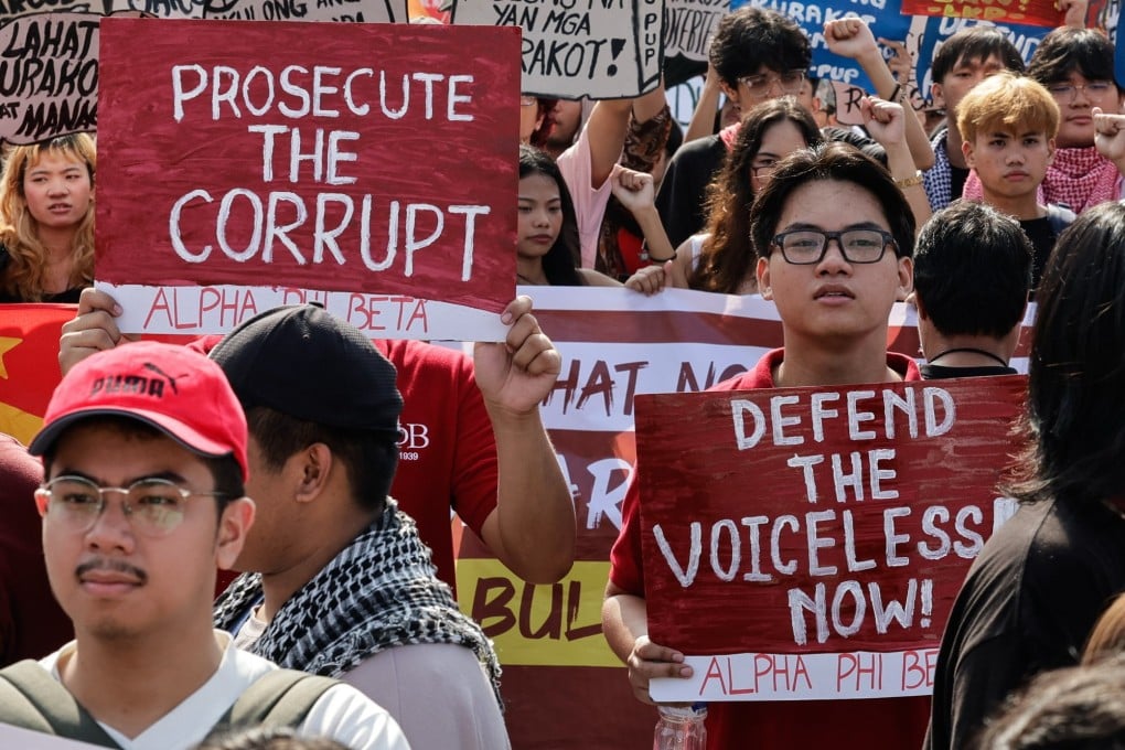 Protesters hold signs during an anti-corruption rally in Manila, the Philippines, on November 30. Photo: EPA