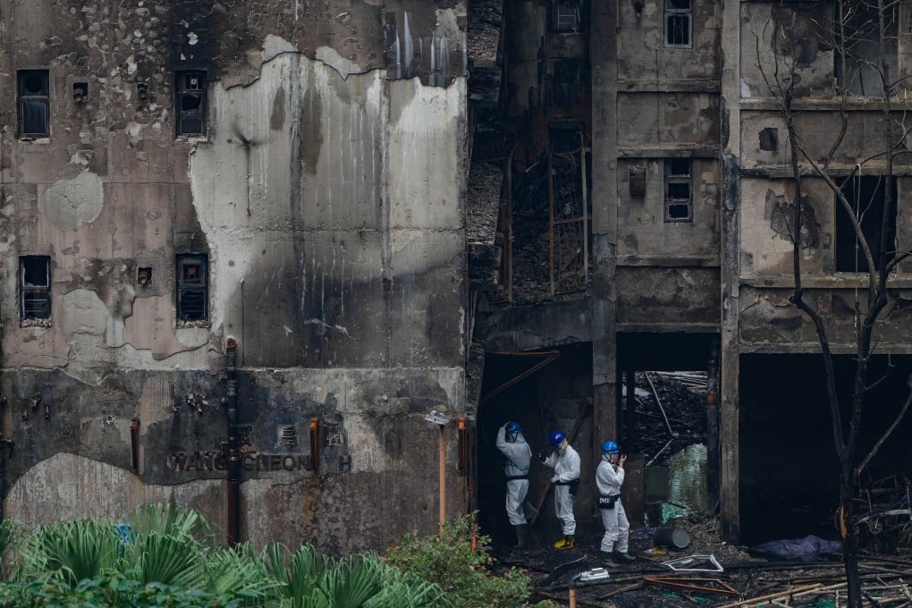 Members of the Disaster Victims Identification Unit work at the scene of the fire in Wang Fuk Court in Tai Po on December 3. Photo: Sam Tsang