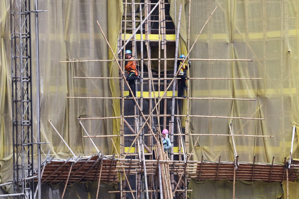 Workers at a construction site in Kai Tak. Photo: Jelly Tse