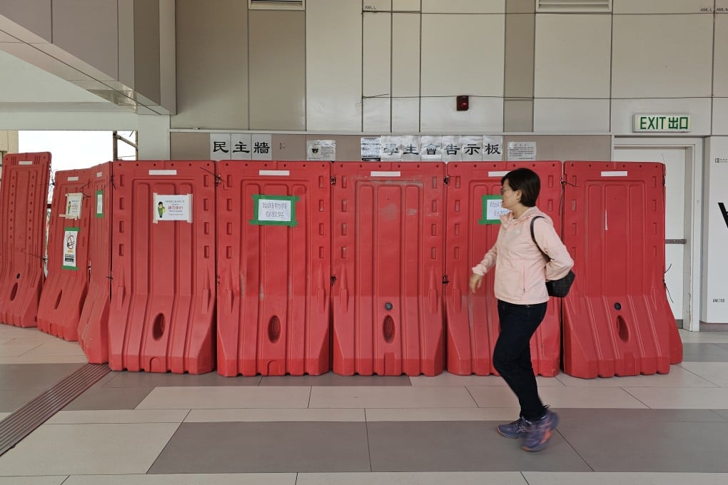 A barrier has been erected blocking the ‘democracy wall’ of the Hong Kong Baptist University student union. Photo: Edmond So