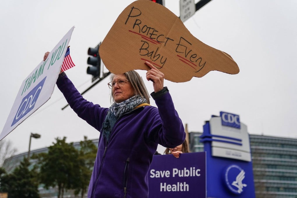 Protesters rally outside CDC headquarter during a meeting of the vaccine committee in Atlanta, Georgia, on Thursday. Photo: AFP