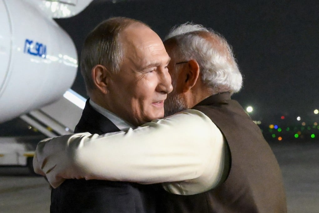 Russian President Vladimir Putin (left) and Indian Prime Minister Narendra Modi embrace at the Palam Air Base in New Delhi on Thursday. Photo: Sputnik/Kremlin/AP
