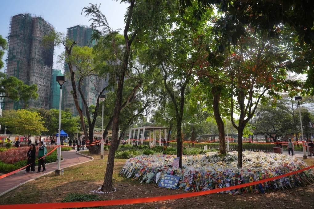 Flowers surround trees at the Kwong Fuk Sitting-out Area near the scene of the fire at Wang Fuk Court. Photo: Elson Li
