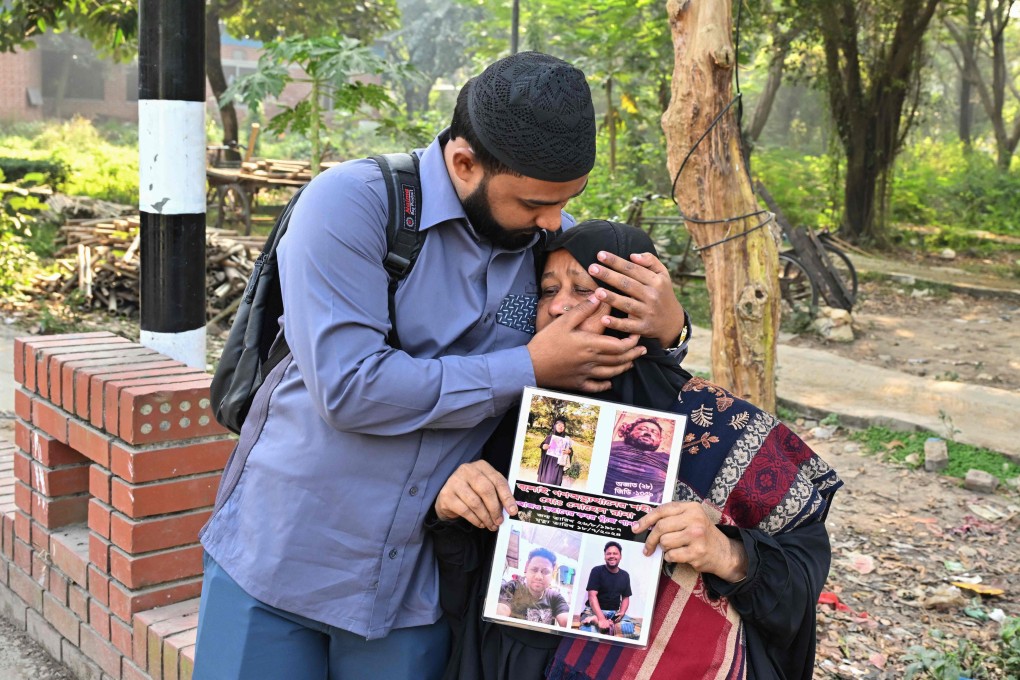 Family members of Sohel Rana, who disappeared during Bangladesh’s July mass uprising, react as they stand outside the Martyred Intellectuals Memorial in Dhaka on Sunday. Photo: AFP