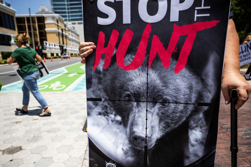 Members of the Animal Rights Foundation of Florida protest against the proposed black bear hunt in Orlando in May. Photo: TNS