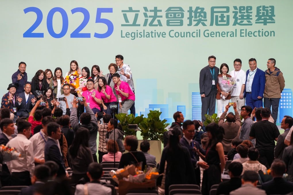 Winners and their supporters pose for pictures in the Hong Kong Convention and Exhibition Centre in Wan Chai on Monday. Photo: Sam Tsang