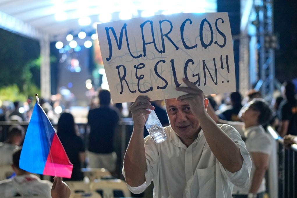 A protester holds a slogan during an anti-corruption rally in Quezon City on November 16. Philippine President Ferdinand Marcos’ satisfaction ratings fell to 21 per cent in November – his steepest decline since February this year. Photo: AP