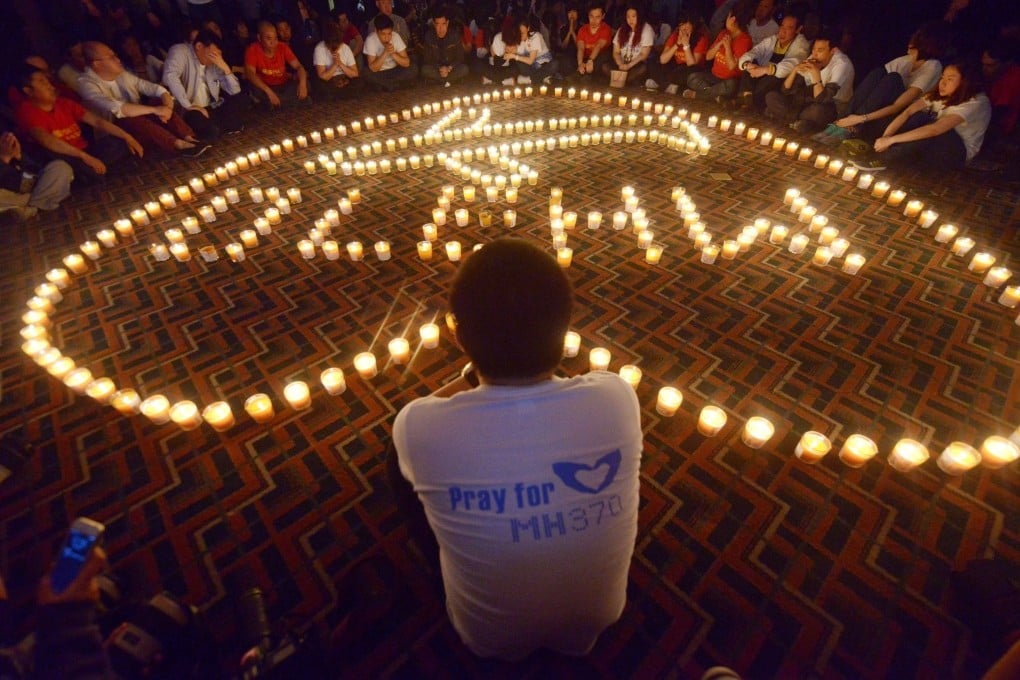 Chinese relatives of flight MH370 passengers take part in a prayer service in Beijing in April 2014. Photo: AFP