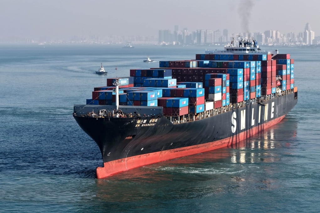 A drone photo taken on December 4 shows a cargo ship loaded with containers departing from Qingdao Port in east China’s Shandong province. Photo: Xinhua