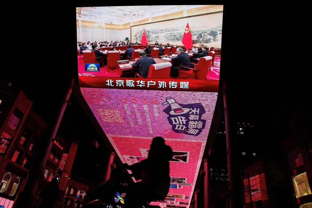 A 2024 meeting of the Politburo of China’s Communist Party is displayed on a video screen in Beijing. Photo: Reuters