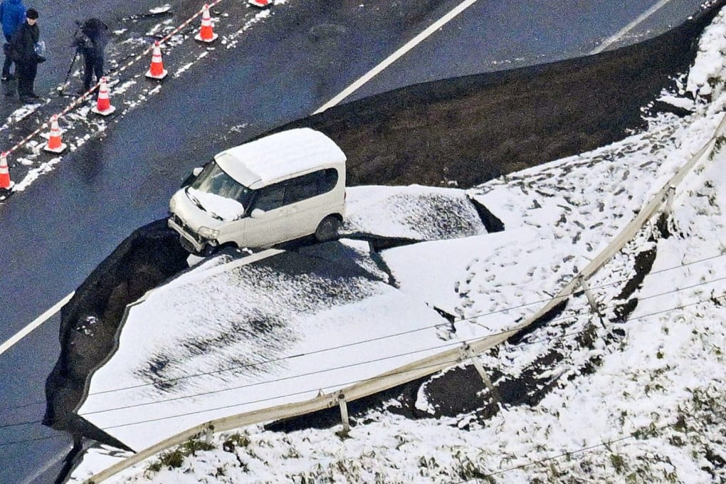 A collapsed road section in Aomori prefecture following the powerful earthquake. Photo: Kyodo