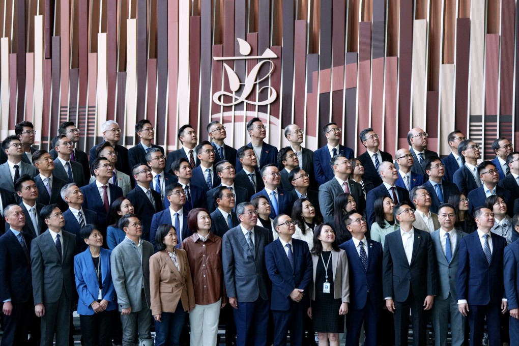 Lawmakers of Hong Kong’s seventh and eighth Legislative Councils pose for photos during a media event at the Legco building in Central on Tuesday. Photo: Sam Tsang