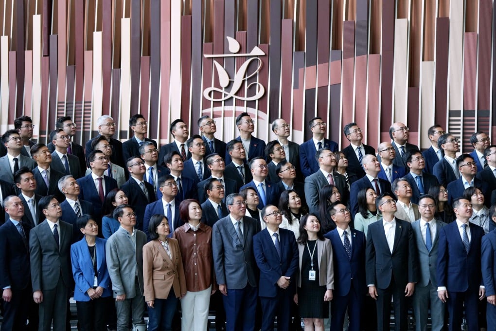 Lawmakers of Hong Kong’s seventh and eighth Legislative Councils pose for photos during a media event at the Legco building in Central on Tuesday. Photo: Sam Tsang