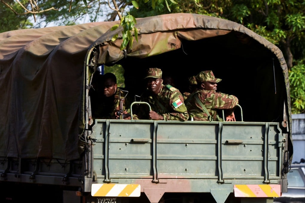 Soldiers patrol in Cotonou, Benin, after the country’s armed forces thwarted an attempted coup against the government. Photo: Reuters