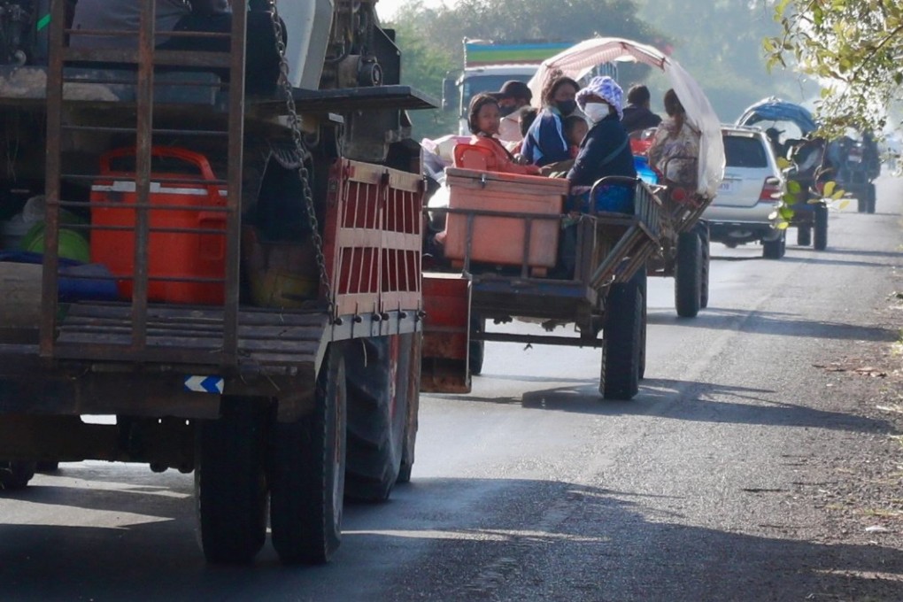 Cambodians flee renewed fighting along the border with Thailand in Oddar Meanchey province on Tuesday. Photo: EPA