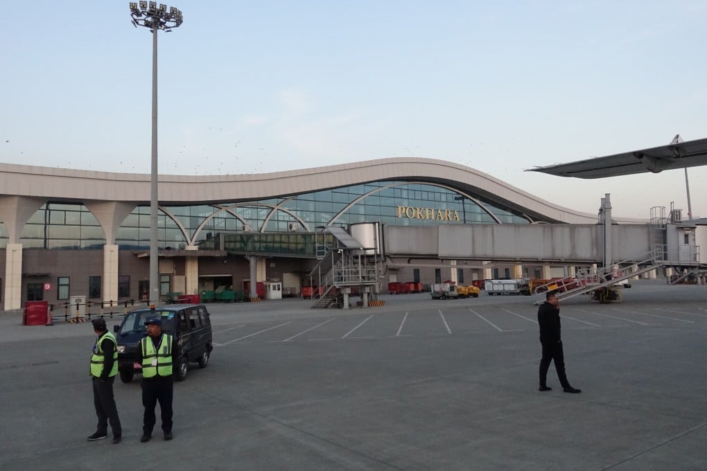 Staff members wait for the arrival of passengers at Pokhara International Airport in December last year. Photo: China News Service/VCG/Getty Images