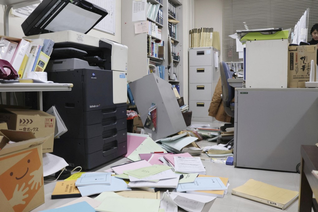 Bookshelves and documents that fell during an earthquake at Kyodo News’ Hakodate bureau in Hakodate, Japan’s Hokkaido on Monday. Photo: Kyodo/Reuters