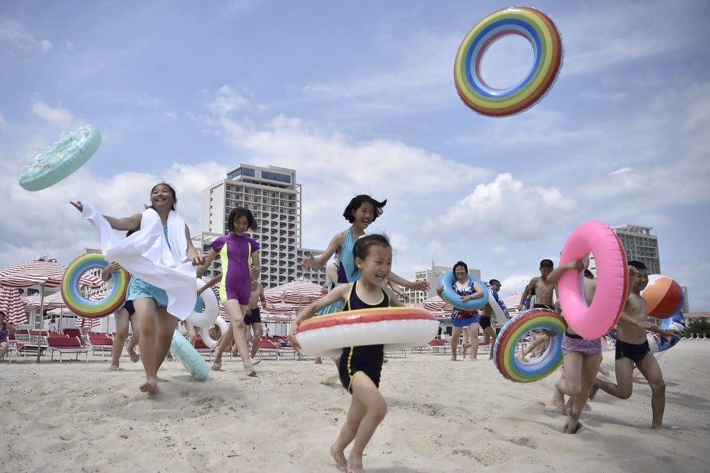 Domestic tourists visit the beach at Wonsan Kalma Coastal Tourist Area in Wonsan, North Korea on July 1. Photo: AFP