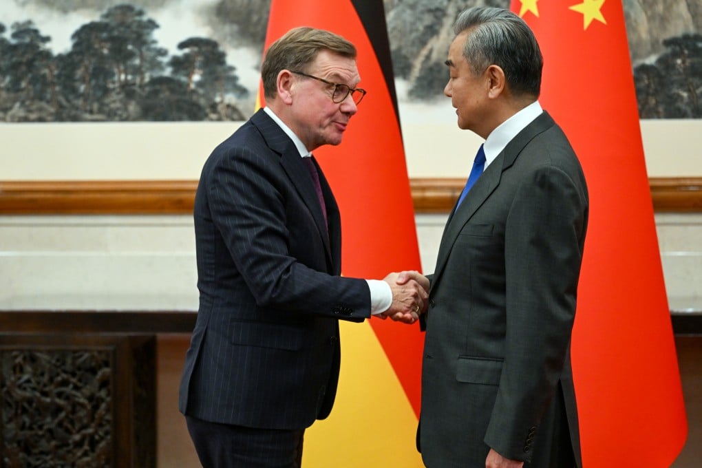 German Foreign Minister Johann Wadephul, left, and Chinese Foreign Minister Wang Yi greet each other before their talks in Beijing on December 8. Photo: dpa