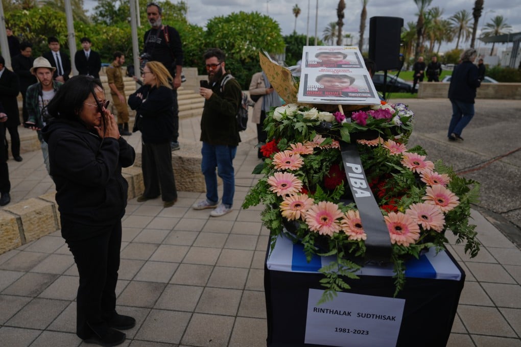 A farewell ceremony was held at Ben Gurion Airport in Israel on Tuesday for Sudthisak Rinthalak before his body was flown back to Thailand for burial. Photo: AP