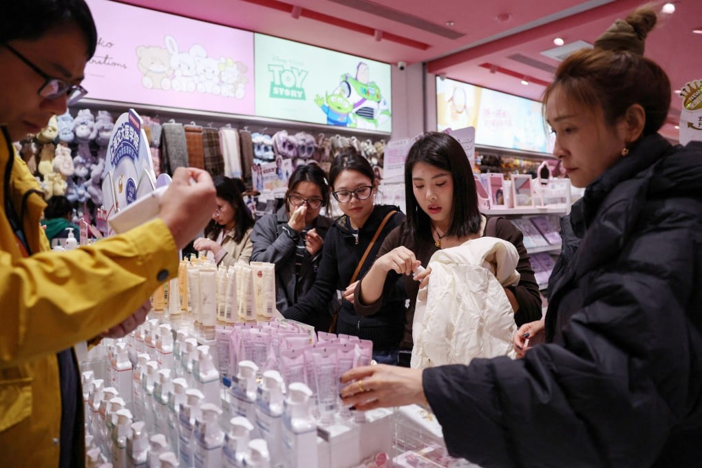 Customers shop at a store in Beijing on October 19. Photo: Reuters