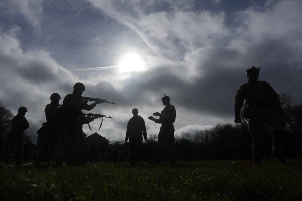 Ukrainian recruits train under British soldiers train at an army camp in England in February 2024. Photo: AP